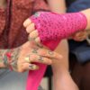 woman carrying handwraps neon pink boxing shirt with glitter boobs design